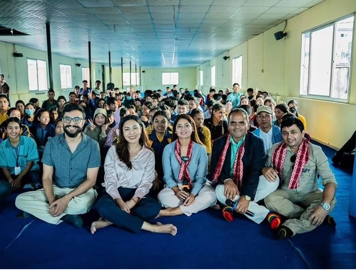 Anushka Shrestha with a crowd at a public event